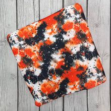 Load image into Gallery viewer, Ready to Ship Bullet Halloween Orange Black Paint Splat makes great bows, head wraps, bummies, and more.